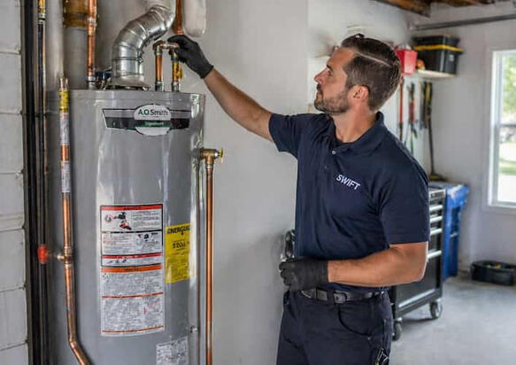 Gas and Electric Water Heater Installation Columbus A newly installed high-efficiency water heater with clean copper piping in a residential utility room.